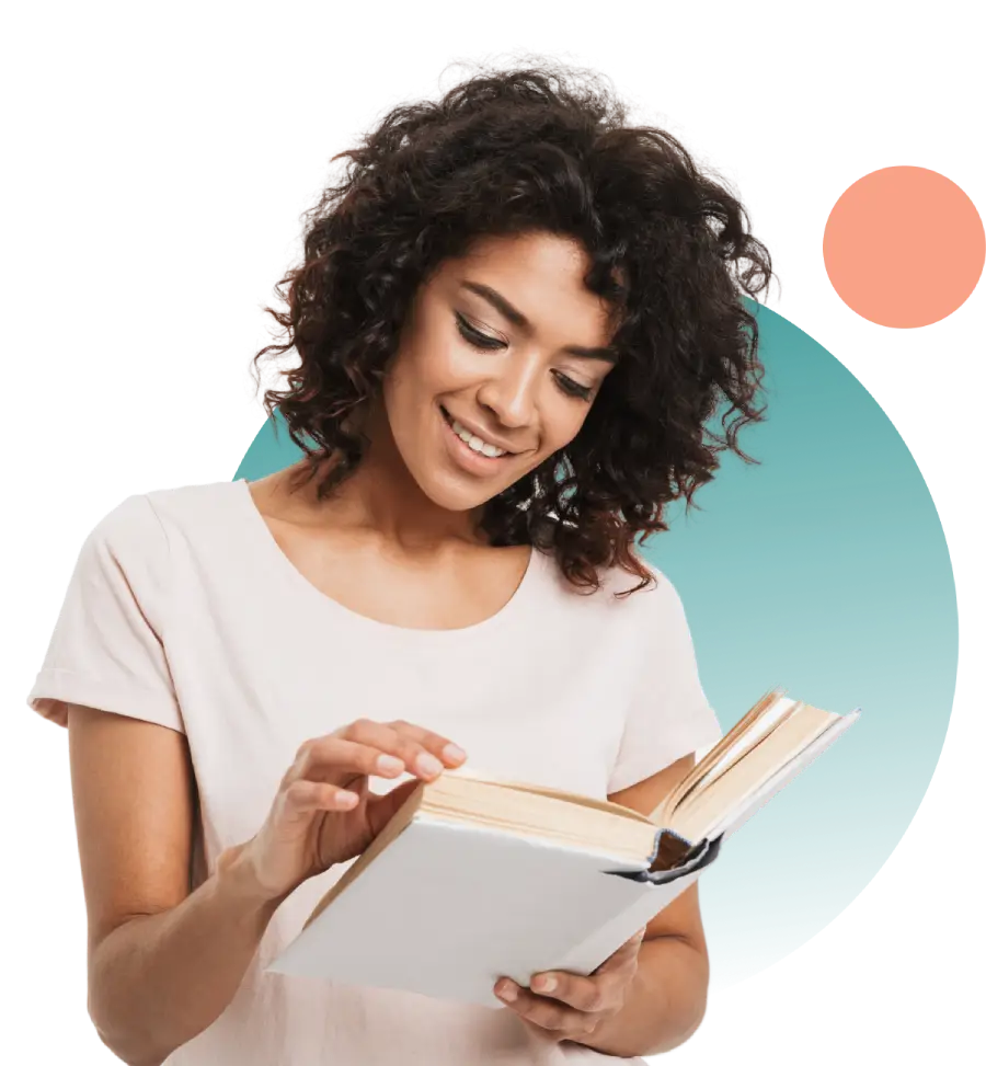 Young woman smiling and reading a book